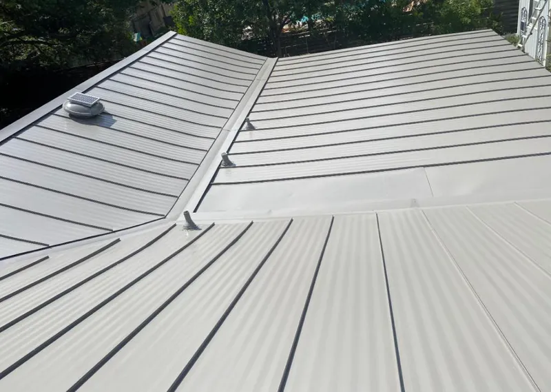 Solar attic fan installed on a metal roof for Roof Ventilation in Altadena